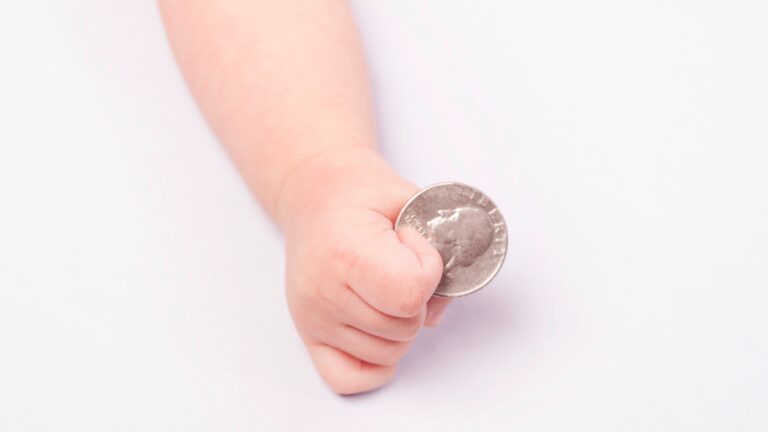 babies eating coins
