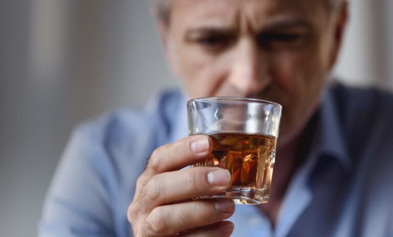 man drinking alcohol
